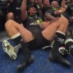 a rugby lads spreads his legs celebration