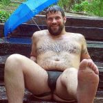 umbrella jock sining in the rain